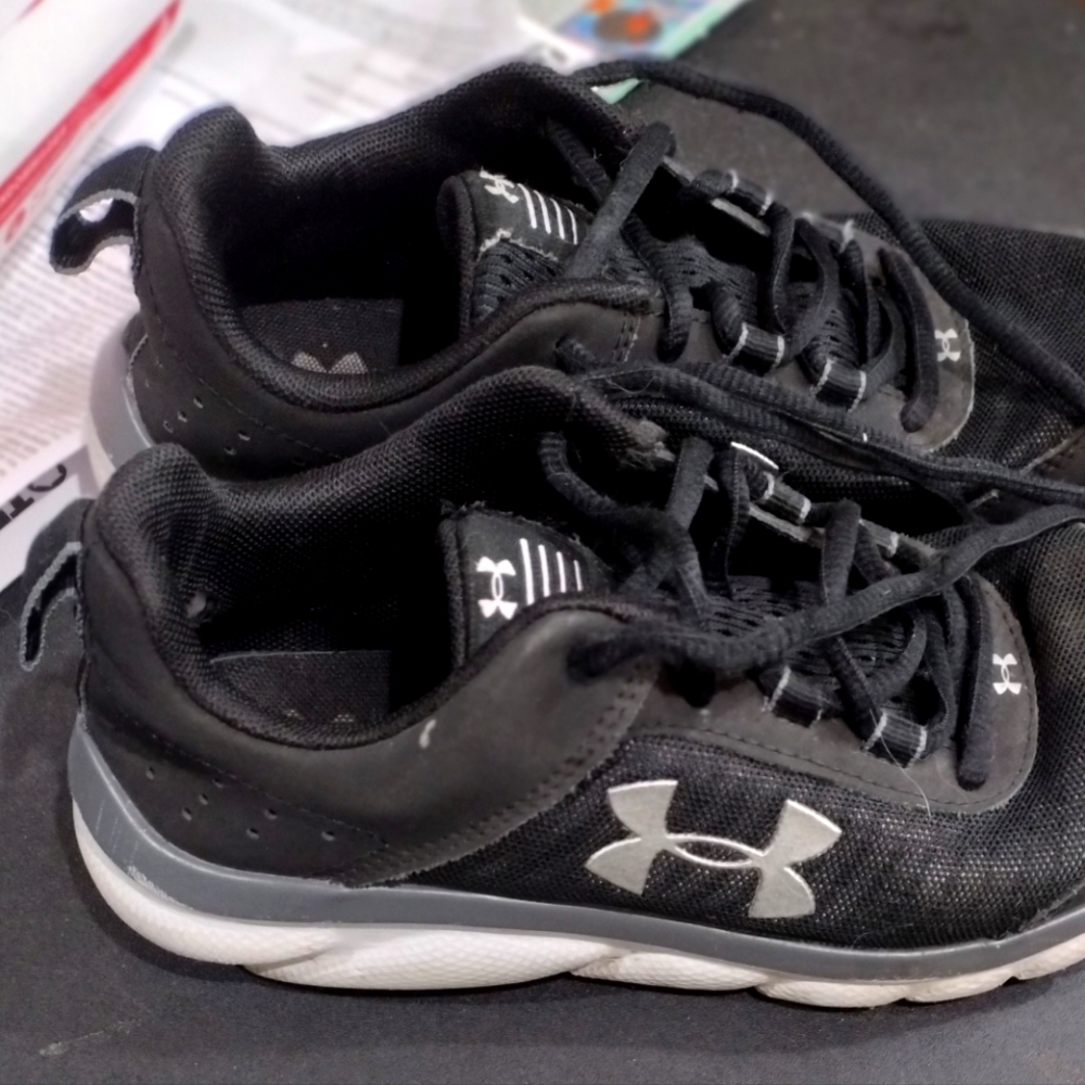 A pair of Under Armour Shoes